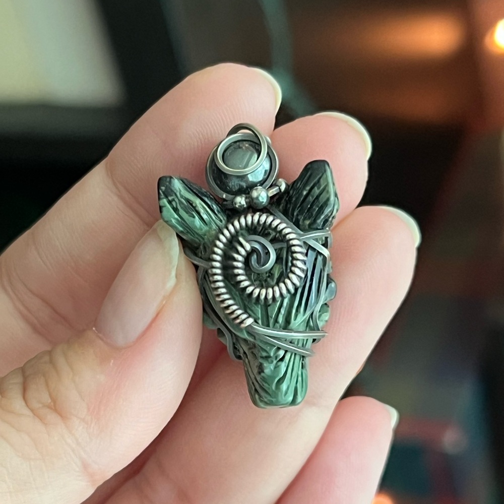 Kambaba Jasper wolf in antiqued sterling silver wire wrapped.
